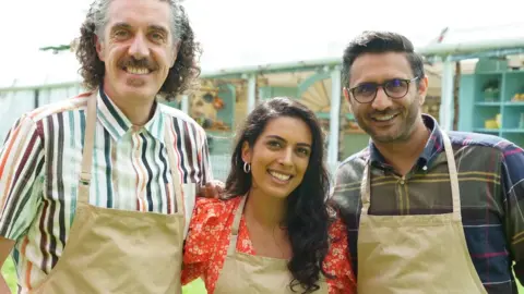 Channel 4 (Left to right) Bake Off finalists Giuseppe, Crystelle and Chigs