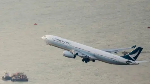 Getty Images Cathay Pacific flight taking off in Hong Kong.