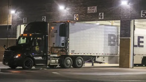 EPA A truck is positioned at the loading dock of the Pfizer Inc., manufacturing and storage facility in Portage, Michigan, USA, 13 December 2020.