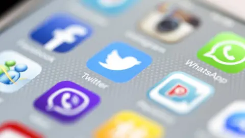 Getty Images Facebook and Twitter apps on a phone