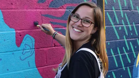 Hazel Oakes Hazel Oakes painting a mural