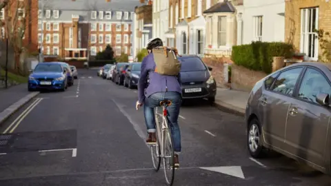 Getty Images Cyclist riding in the street