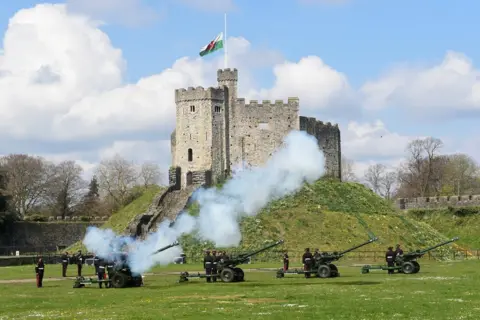 Reuters View of the first shot during a gun salute to mark the death of Prince Philip, husband of Queen Elizabeth, at Cardiff Castle, in Cardiff, Wales, Britain April 10, 2021.