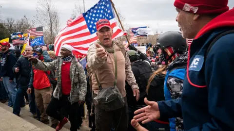 Getty Images Mr Epps (centre) was outside the Capitol on 6 January 2021