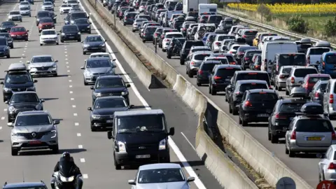 AFP/Getty Images Motorists drive in France