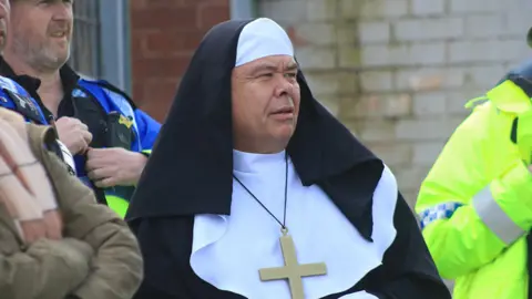 Professor Sir Jonathan Van-Tam dressed as a nun