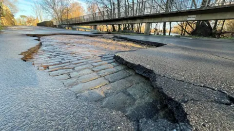 Steve Hubbard/BBC Road with broken surface