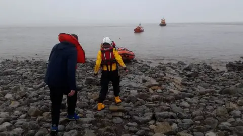 RNLI/Penarth Three Russians being rescued