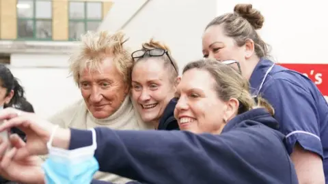 PA Media Sir Rod Stewart and medical staff