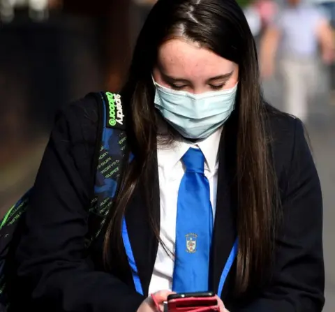 Getty Images pupil looks at phone