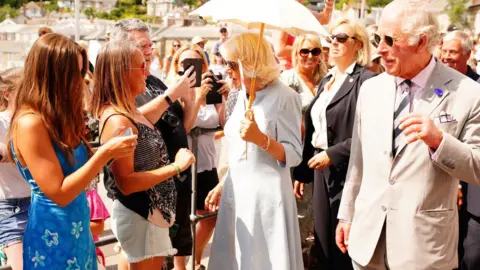 PA Media The Duke and Duchess of Cornwall in Mousehole