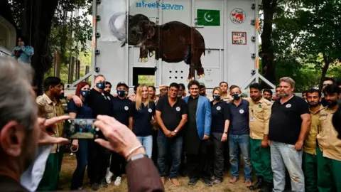 Getty Images Four Paws International team and wildlife rangers at the zoo in Islamabad. 29 Nov 2020