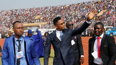 Reuters Cameroon international soccer player Samuel Eto'o Fils arrives for Liberia's new President George Weah swearing-in ceremony at the Samuel Kanyon Doe Sports Complex in Monrovia, Liberia, January 22, 2018.