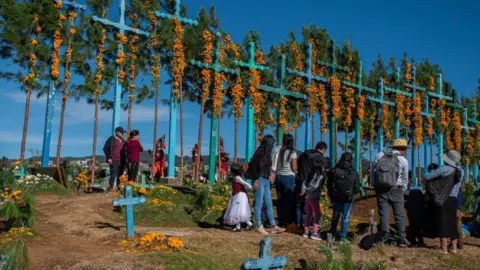 EPA Tsotzile indigenous people decorate tombs of relatives in San Juan Chamula, Chiapas state