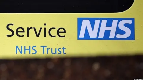 Getty Images Sign on ambulance outside hospital