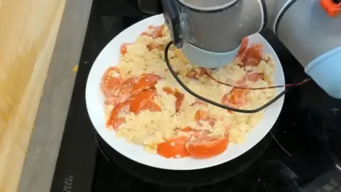 University of Cambridge/PA Robot probing some food