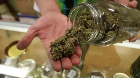 Getty Images Image of marijuana being held in a hand