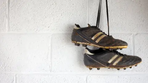 tomandsteve football boots hanging up