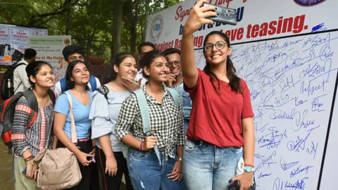 Getty Images Delhi university students at a campaign against eve teasing