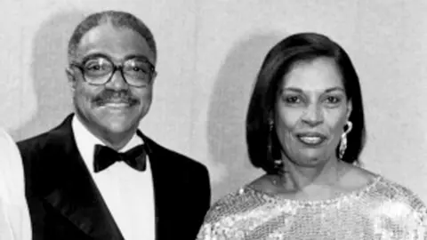 Getty Images Joan Johnson (right) with her husband George (left)