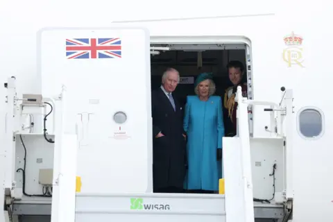 Getty Images King Charles and Camilla arrive in Germany