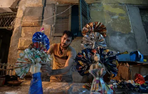 AFP A man decorates traditional sugar candy at a market in the capital Cairo on November 19, 2018, ahead of celebrations of the birthday of Prophet Mohammed, known in Arabic as "al-Mawlid al-Nabawi".