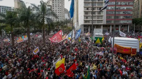 Getty Images Crowds gather outside the University of Sao Paulo's Law School