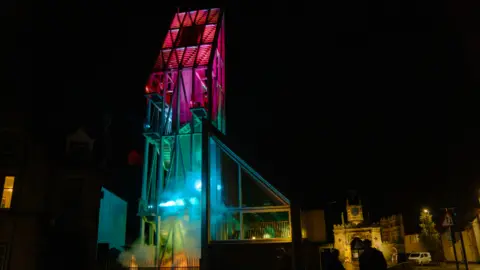 Emily Carey The Auckland Tower in Bishop Auckland illuminated by Phil Supple's artwork The Drop