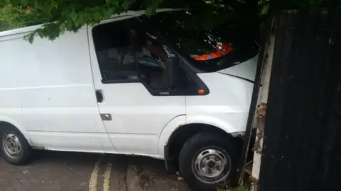 Nottinghamshire Police The van was found crashed into a garden fence after Thomas fled on foot.