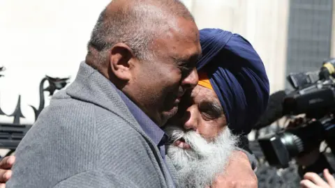 PA Media Harjinder Butoy embraces his father