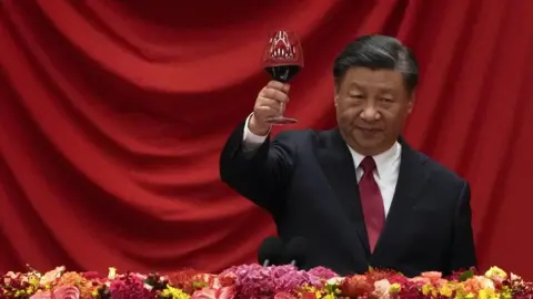 Chinese President Xi Jinping makes a toast after delivering his speech at a dinner marking the 74th anniversary of the founding of the People's Republic of China at the Great Hall of the People on September 28, 2023 in Beijing, China