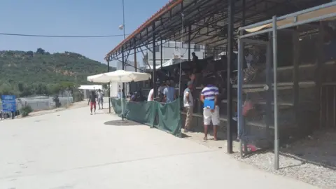 A shelter where people gather to shelter from the sun at Moria refugee camp