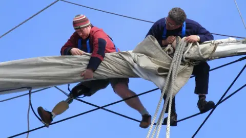 Jubilee Sailing Trust Crew at work on a JST ship