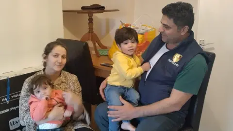 BBC Noorullah Hashmi,his wife Honey and their two boys, Altan and baby Alman