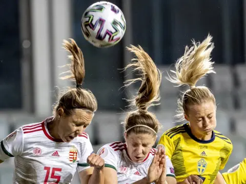 Adam Ihse / EPA Footballers vie for the ball during Hungary's Uefa Women's Euro 2021 qualifying tie against Sweden in Gothenburg