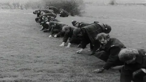 Police carrying out a fingertip search during Janet Commins murder investigation