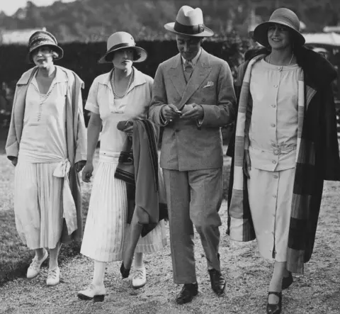 Getty Images George Mountbatten with his wife Nadejda (centre left) and friends in Deauville, France, 1924