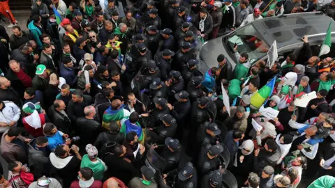 EPA Algerians protest against President Abdelaziz Bouteflika in Algiers, Algeria, 25 March 2019.