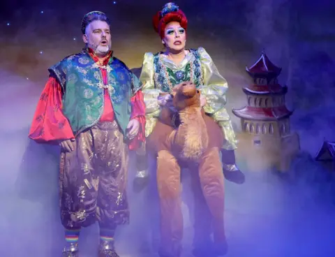 Barry Rivett Andy Collins and La Voix in Aladdin at the Waterside Theatre, Aylesbury