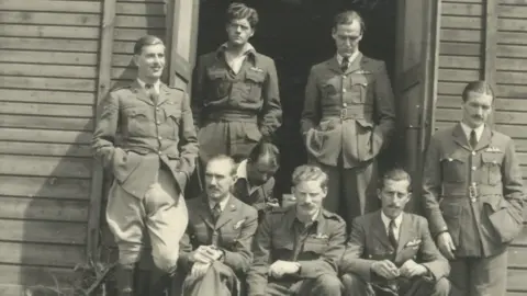 Gunn Family Alastair Gunn with his roommates outside Hut 122 in Stalag Luft III.