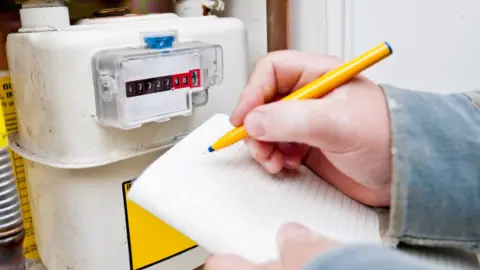 Getty Images Person taking a meter reading
