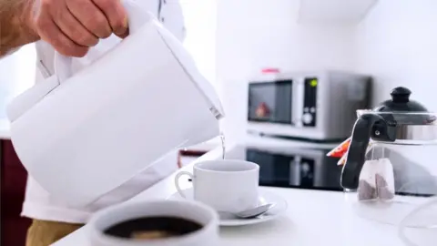 Getty Images Man making coffee