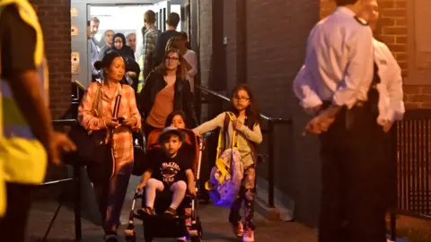 AFP/Getty Images Family moving out of Taplow block