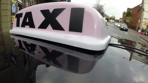 BBC Sign above a taxi cab