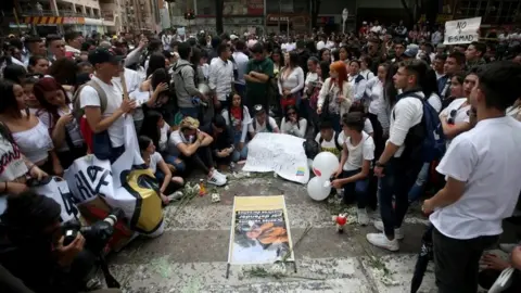 Reuters People gather in the street where Dilan Cruz was injured in Bogota, Colombia November 24, 2019