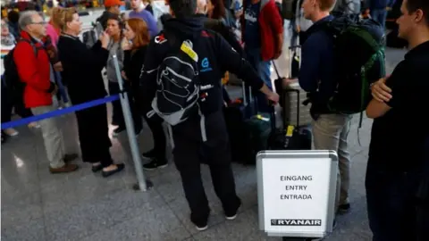 Reuters Stranded Ryanair passengers queue for hotel vouchers and new tickets