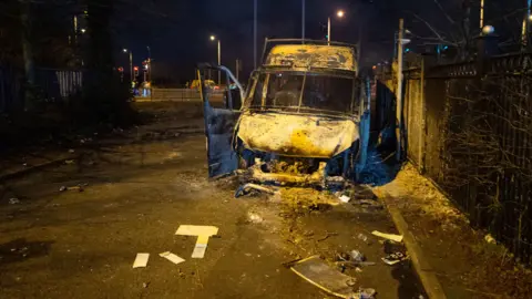 Burnt out police van