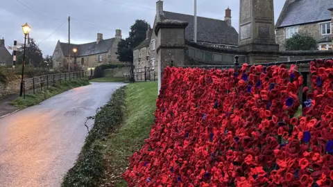 BBC Knitted poppies at Gretton war memorial