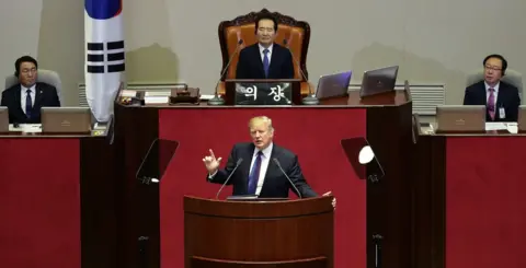 EPA US President Donald J. Trump (C, bottom) speaks at the National Assembly in Seoul, South Korea, 8 November 2017.