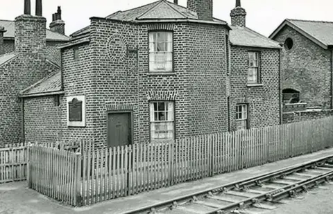 Friends of Stockton & Darlington Railway Old picture of the building with plaque and railway line